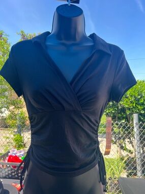 Almost Famous Black Crewneck top with a V-neck, collar, and ruched sides.